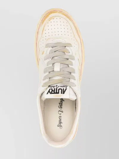 Autry Low-top Sneakers With Distressed Finish And Perforated Detailing In White