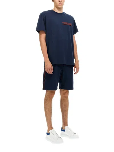 Alexander Mcqueen Men Bermuda Shorts With Selvedge Logo Band In Blue