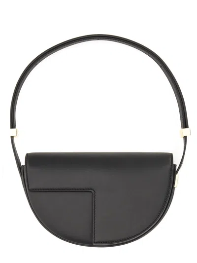 Patou Semi-round Shoulder Bag In Black