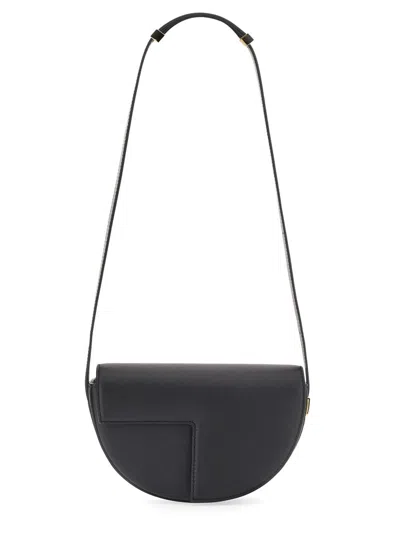Patou Semi-round Shoulder Bag In Black