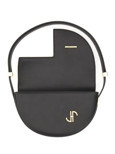 Patou Semi-round Shoulder Bag In Black