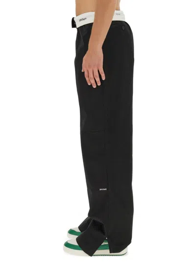 Palm Angels Contrasting-waistband Tapered Trousers In Black