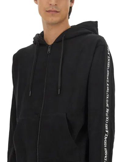 Versace Jeans Couture Full-zip Hoodie With Adjustable Drawstrings And Subtle Branding In Black