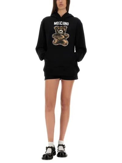 Moschino Graphic Print Hooded Kangaroo Pocket Knitwear In Black