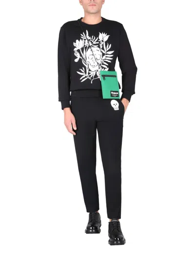 Alexander Mcqueen Jogging Pants With Embroidered Skull In Black
