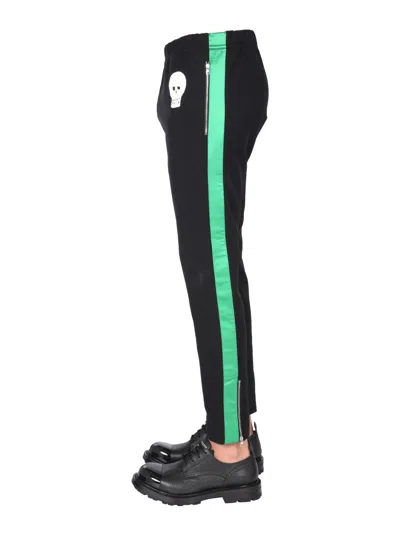 Alexander Mcqueen Jogging Pants With Embroidered Skull In Black