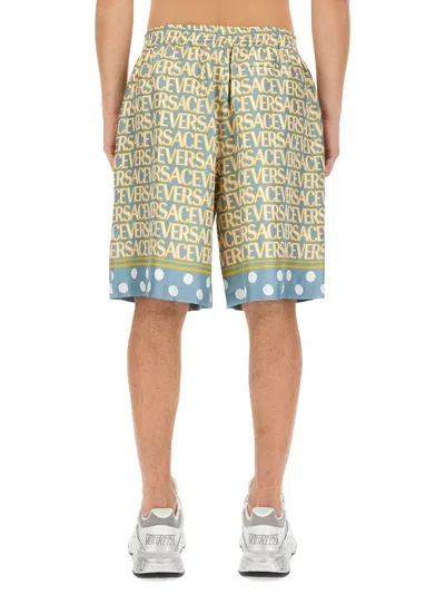 Versace Silk Bermuda Shorts With All-over Logo