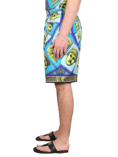 Versace Le Maschere Print Silk Shorts In Blue