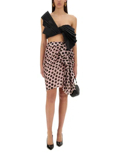 Nina Ricci Polka Dot Seersucker Skirt With Asymmetric Bow In Black On Blush In Pink