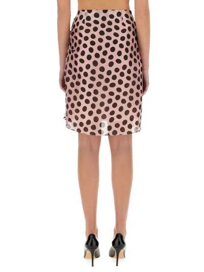 Nina Ricci Polka Dot Seersucker Skirt With Asymmetric Bow In Black On Blush In Pink