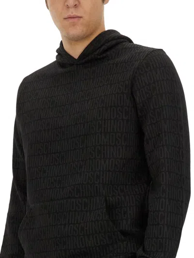 Moschino Sweatshirt With All Over Logo In Black