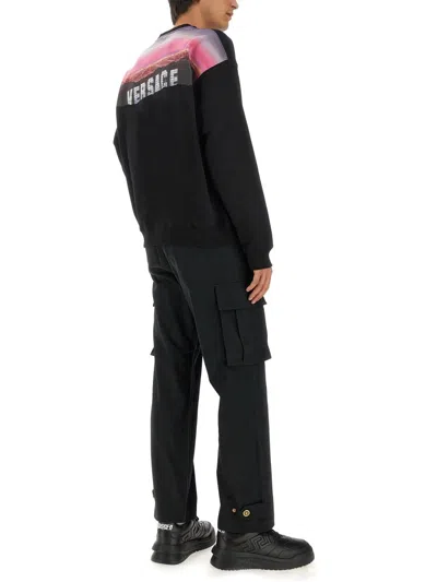 Versace Graphic Print Oversize Cotton Sweatshirt In Black