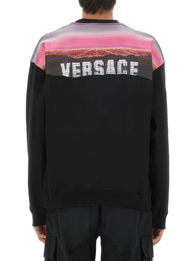 Versace Graphic Print Oversize Cotton Sweatshirt In Black