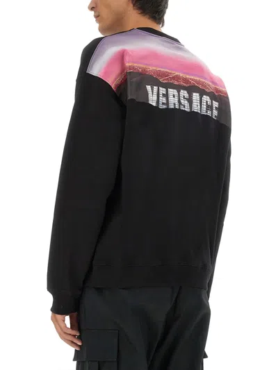 Versace Graphic Print Oversize Cotton Sweatshirt In Black