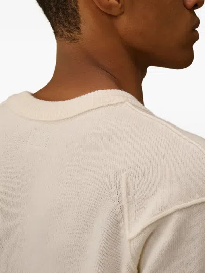 C.p. Company Crewneck Lambswool Sweater With Iconic Lens Detail In Neutral
