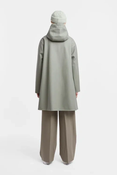 Stutterheim Mosebacke Hooded Long Sleeve Raincoat In Green