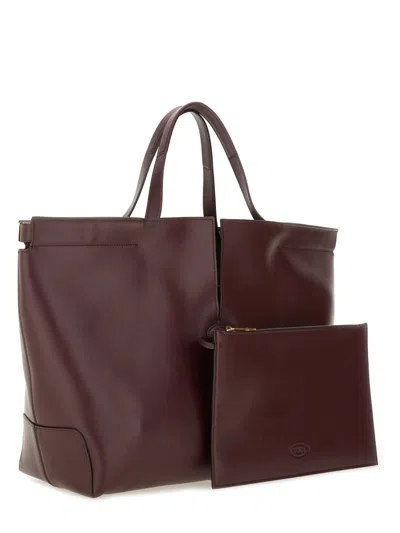 Tod's Bordeaux Tote Bag With Two Top Handles And Embossed Logo Lettering On The Front In Burgundy