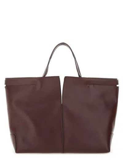 Tod's Bordeaux Tote Bag With Two Top Handles And Embossed Logo Lettering On The Front In Burgundy