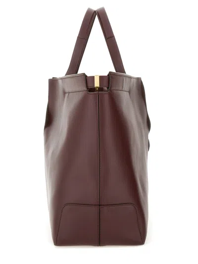 Tod's Bordeaux Tote Bag With Two Top Handles And Embossed Logo Lettering On The Front In Burgundy