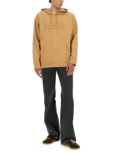 Mm6 Maison Margiela Mm6 By Maison Margiela Relaxed-fit Cotton Hoodie With Unique Graphic Print In Brown
