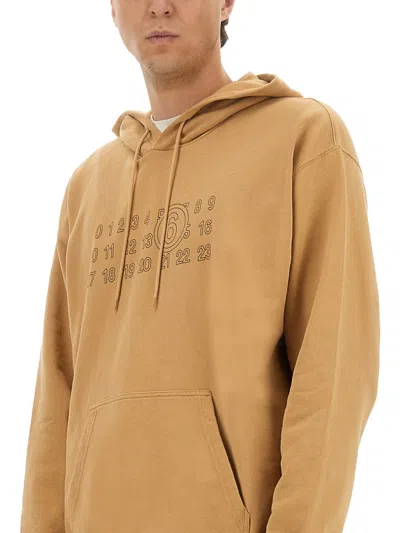 Mm6 Maison Margiela Mm6 By Maison Margiela Relaxed-fit Cotton Hoodie With Unique Graphic Print In Brown