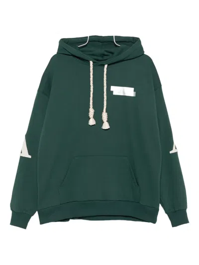 Al Ain Loose Fit Hoodie With Braided Drawstrings And Bold Graphics In Green