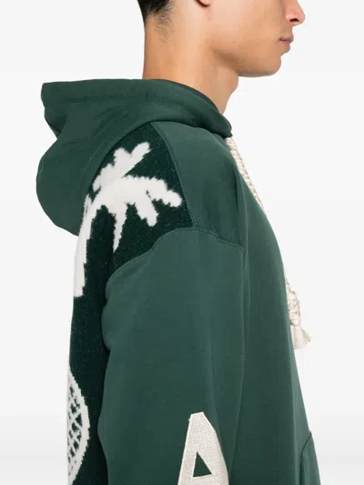 Al Ain Loose Fit Hoodie With Braided Drawstrings And Bold Graphics In Green
