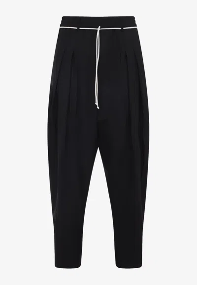 Mordecai Tapered Black Trousers With Pleated Front In Black