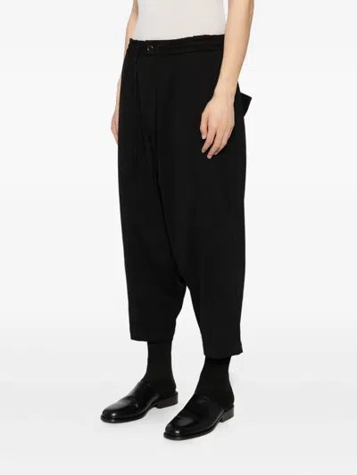 Devoa Water-repellent Trousers In Black