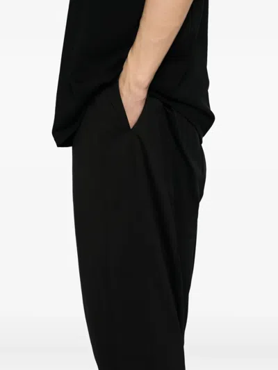 Devoa Water-repellent Trousers In Black