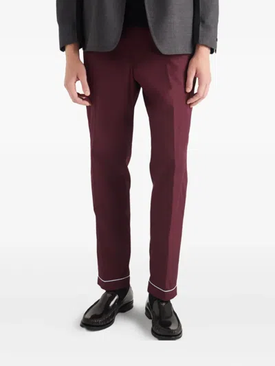 Prada Piped-trim Cotton Trousers In Burgundy