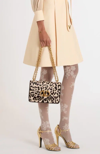 Valentino Garavani Vain Small Cow-print Leather And Calf-hair Shoulder Bag In Animal Print