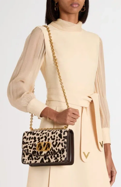 Valentino Garavani Vain Small Cow-print Leather And Calf-hair Shoulder Bag In Animal Print