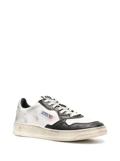 Autry Vintage Low Top Sneakers For Men In Neutral