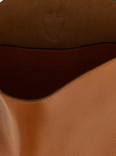 Tod's Brown Textured Leather Bucket Bag With Adjustable Strap And Gold-tone Logo