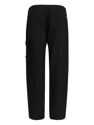 C.p. Company Trousers Featuring Various Functional Pockets In Black