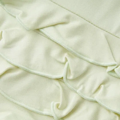 Milkbarn Luxe Solid Ruffle Footed Romper In Green