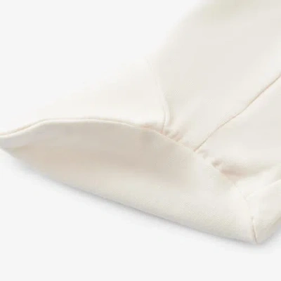 Milkbarn Luxe Solid Ruffle Footed Romper In White