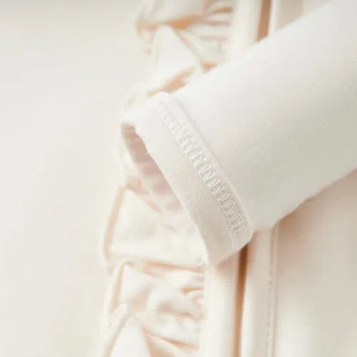 Milkbarn Luxe Solid Ruffle Footed Romper In White