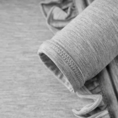 Milkbarn Luxe Solid Ruffle Footed Romper In Gray