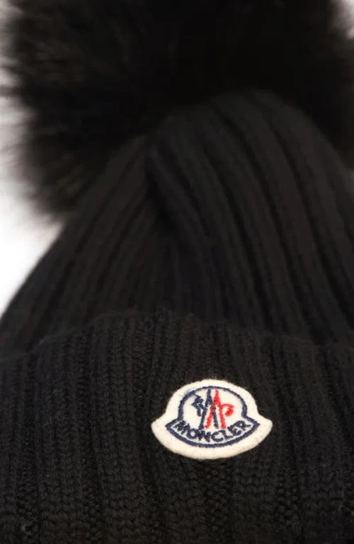 Moncler Ribbed Knit Wool Beanie With Faux Fur Pom-pom In Black