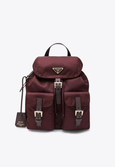 Prada Bordeaux Re-nylon Backpack With Golden Hardware In Red
