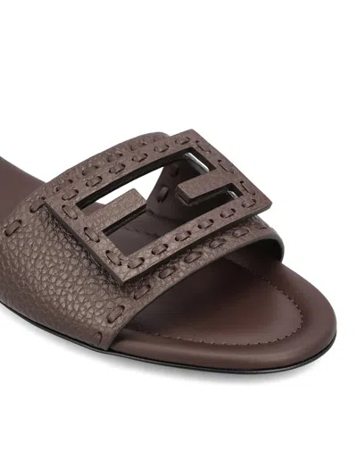 Fendi Flat Sole Open Toe Textured Strap Slides In Brown