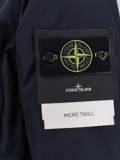 Stone Island Relaxed-fit Blue Coat With Button Closure And Signature Logo Patch In Blue