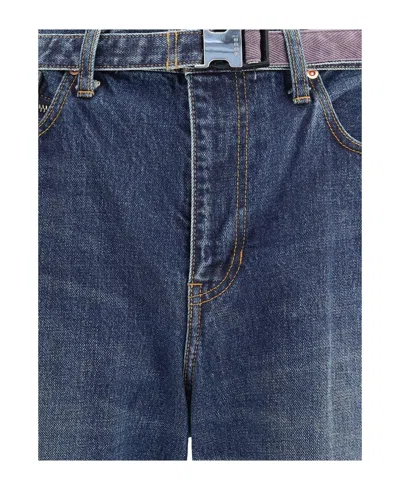 Sacai Belted Zip-pocket Jeans In Blue