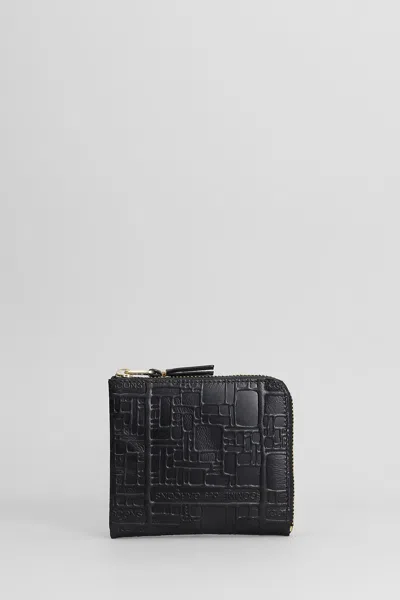 Comme Des Garçons Embossed Logotype Wallet In Black