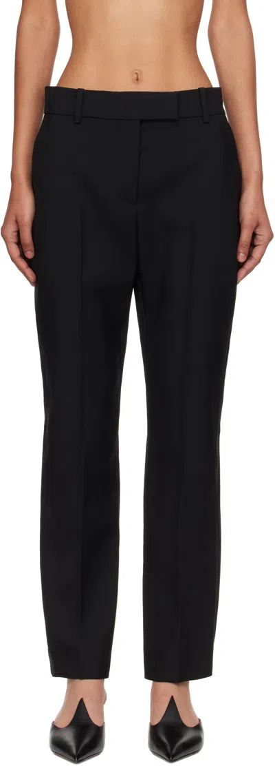 Alexander Mcqueen Tailored Wool Trousers Featuring Flared Hem In Black