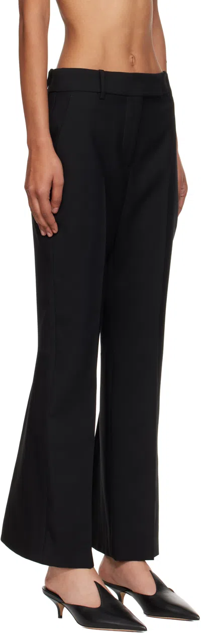 Alexander Mcqueen Tailored Wool Trousers Featuring Flared Hem In Black