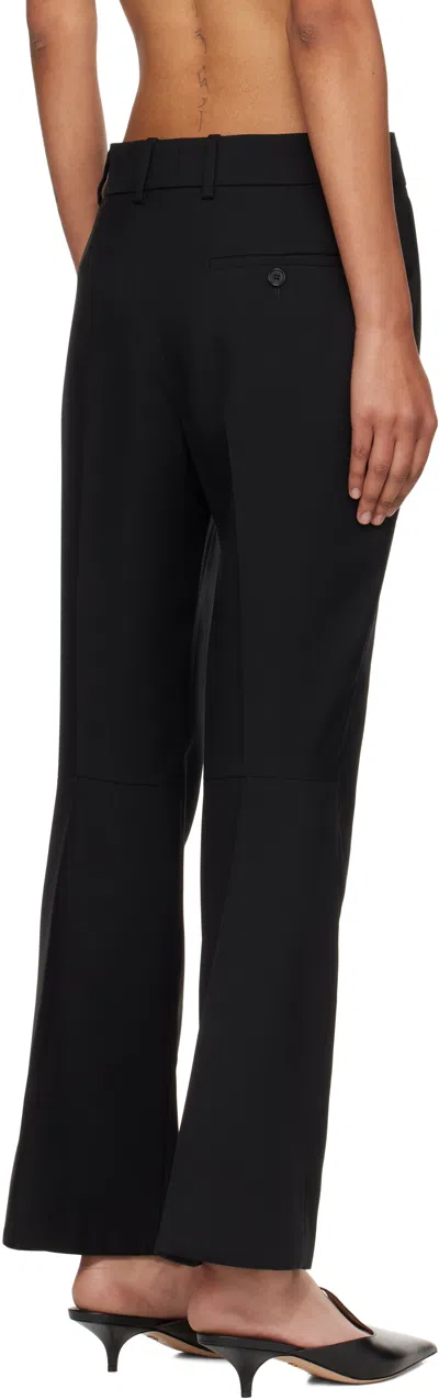 Alexander Mcqueen Tailored Wool Trousers Featuring Flared Hem In Black