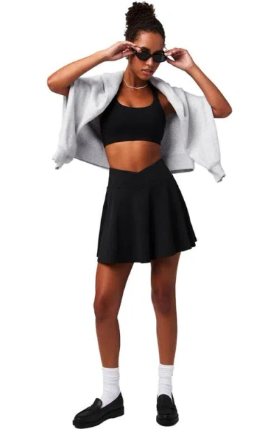 Fabletics Crossover Flounce Skirt In Black